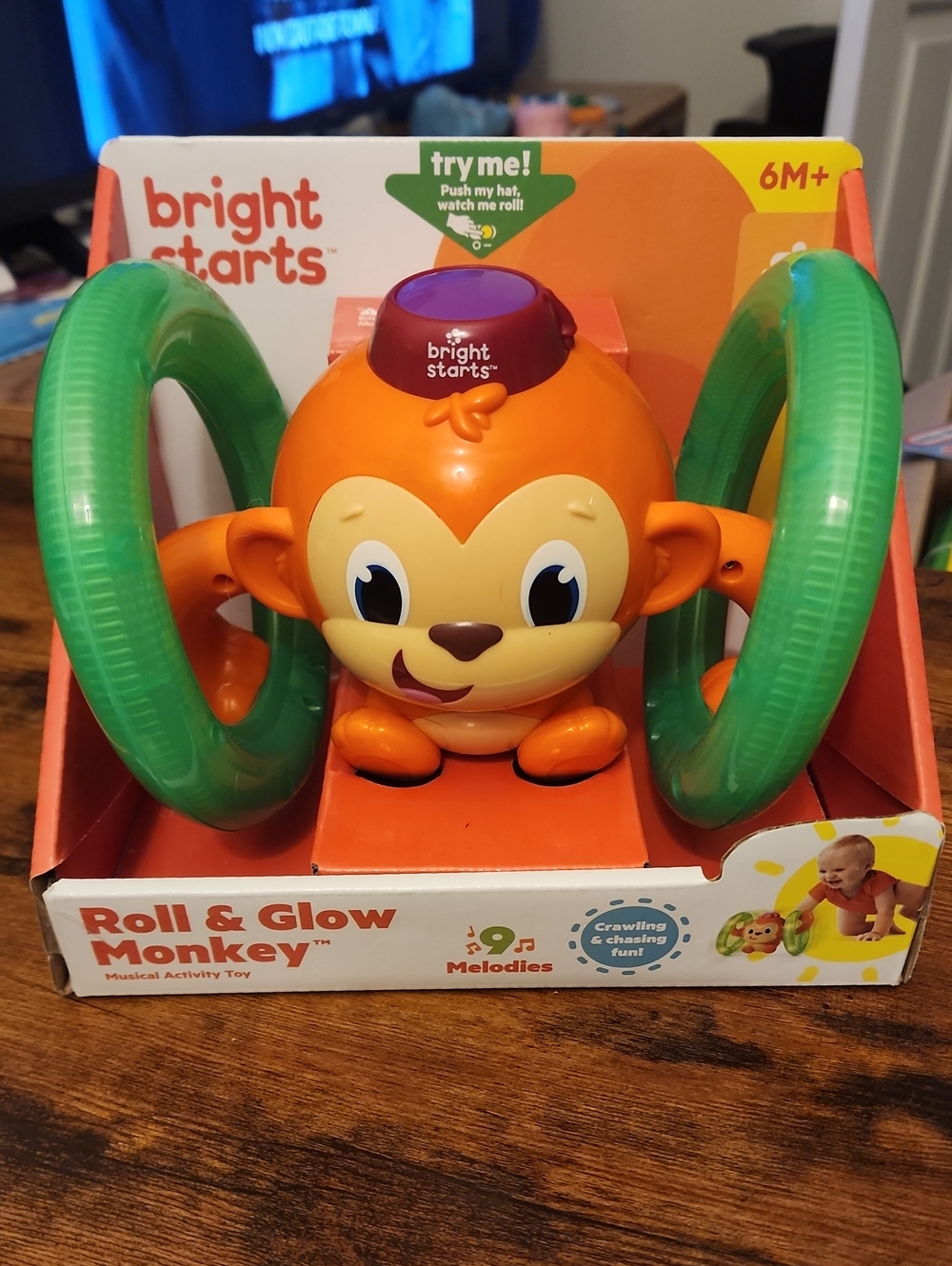 Bright Starts Roll & Glow Monkey Toy - Orange with Green Rings